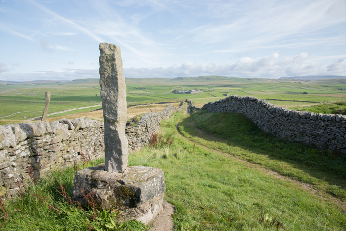 Stone waymarker on Calton Moor at Weets Gate